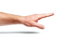 Male hand pointing right with index finger on white isolated background, showing direction or choice gesture. Clean professional studio lighting.