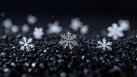 White delicate snowflakes on dark glittering background with bokeh effect create magical winter atmosphere, macro photography for seasonal designs and holiday cards.