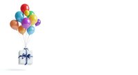 Colorful balloons in red, blue, green, yellow, purple, and orange tied to a white gift box with blue ribbon on isolated white background for celebrations and party designs.