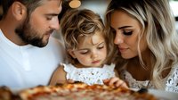 Young family with toddler girl looking at fresh pizza together, intimate moment of parents and child enjoying homemade meal.