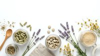 Natural herbal medicine ingredients with lavender, cardamom pods, seeds and dried flowers arranged on white background for wellness and aromatherapy.