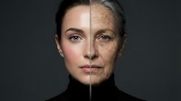 Split face portrait showing young and elderly Caucasian woman demonstrating aging process with wrinkles and age spots for skincare and anti-aging concepts.
