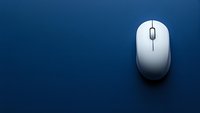 White wireless computer mouse on dark blue background with soft shadow and copy space, minimalist composition for technology and business concepts.
