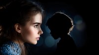 Young woman in profile with dramatic side lighting against dark background, silhouette of child figure creating mysterious atmospheric mood for conceptual themes.