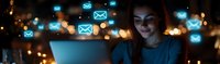 Young woman using laptop at night with glowing blue email icons floating around, depicting digital communication and modern lifestyle in dark ambient setting.