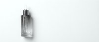 Elegant glass perfume bottle with silver cap on clean white background for luxury cosmetics and fragrance branding projects.