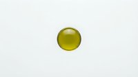 Yellow glossy sphere with realistic lighting and shadow effects isolated on white background for graphic design and digital art projects.