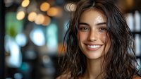 Young Hispanic woman with wet dark hair and bright smile against blurred bokeh lights background in cozy indoor setting, natural beauty portrait.