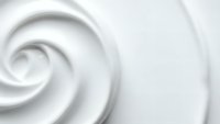 Smooth white cream swirl texture with elegant spiral pattern for cosmetic skincare beauty product backgrounds and luxury spa wellness designs.