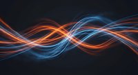 Abstract flowing light trails in blue and orange colors creating dynamic wave patterns on dark background for modern digital design projects.