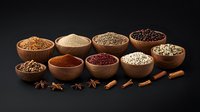 Aromatic spices and seasonings in wooden bowls arranged on dark background with star anise and cinnamon sticks, culinary ingredients for cooking and baking.