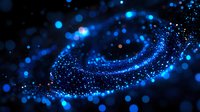 Magical blue glowing particles swirling in dark space creating cosmic spiral pattern with bokeh light effects and sparkles against black background.