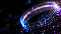Glowing spiral of blue and purple light particles with bokeh effect against dark background creates magical cosmic atmosphere.