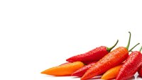 Fresh red and orange chili peppers isolated on white background for culinary and cooking designs.