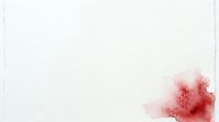 Red watercolor ink splash isolated on white background, suitable for design projects, backgrounds, and artistic compositions.