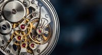 Intricate mechanical watch movement with exposed gears, springs and jeweled bearings showcasing precision craftsmanship and timekeeping engineering on dark background.