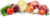 Fresh vegetables and raw meat ingredients arranged on white background for healthy cooking and meal preparation.