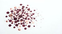 Abstract burgundy and pink watercolor drops scattered on white background creating artistic paint splatter effect for creative design projects.