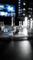 Glass chess pieces on a reflective board with dark bokeh background, king in focus, evoking strategy, leadership, and business competition.