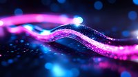 Glowing neon wave with sparkling particles flows through dark space creating magical light trail effect in pink and blue colors against blurred bokeh background.