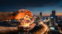 Hands protecting glowing geometric crystal over illuminated city skyline at dusk. Business protection, innovation and urban development concept for presentations.