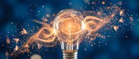 Glowing light bulb with DNA helix and floating particles symbolizing innovation, creativity, and scientific breakthrough in research and development.