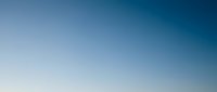 Clear blue sky gradient background transitioning from light to deep blue, perfect for presentations, websites, and digital design projects.