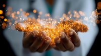 Magical glowing golden sparkles and light particles floating above cupped hands against dark background, creating mystical atmosphere for spiritual and wellness concepts.