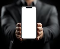 Businessman in formal suit holding smartphone with blank white screen, perfect for app or website mockup presentation.