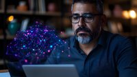 Middle-aged Hispanic businessman with glasses and gray beard examining glowing purple and blue holographic network visualization projected from laptop in dark office.