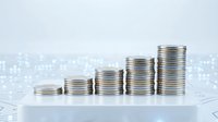 Growing stacks of silver coins arranged in ascending order representing financial growth, investment success, and wealth accumulation for business concepts.
