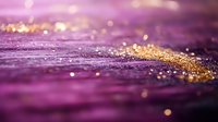 Magical purple and gold glitter background with bokeh effect and sparkles creating dreamy abstract texture for luxury design and festive decoration.