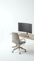 Modern minimalist home office workspace with wooden desk, gray ergonomic chair, computer monitor and keyboard on clean white background for remote work.