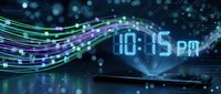Digital clock display showing 10:15 pm with flowing neon light trails and bokeh effects on dark background for technology and time concepts.