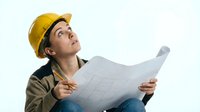 Young male construction worker wearing yellow hard hat and olive jacket, holding blueprint while looking upward, isolated on white background for design projects.
