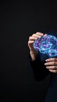 Human hands protecting glowing digital brain hologram on dark background representing artificial intelligence and mental health protection.