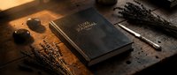 Elegant dark leather journal on rustic wooden table with dried lavender, smooth stones, and a pen in warm golden light, evoking mindfulness.