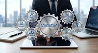 Professional businessman presenting consulting services concept with interconnected gear icons on tablet in modern office environment for business strategy solutions.
