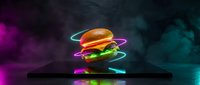 Floating hamburger with glowing neon light trails on dark background. Fast food concept with colorful electric effects for advertising and marketing materials.