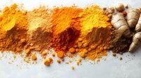 Fresh turmeric root and ground spice powder in various shades from bright yellow to deep orange scattered on white surface, aromatic cooking ingredient.