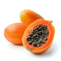 Fresh ripe papaya fruits, one cut in half showing black seeds and orange flesh, isolated on white background for food and healthy eating concepts.