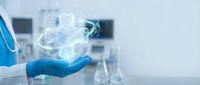 Healthcare professional in blue gloved hand holding glowing molecular structure with laboratory equipment blurred in background, representing medical research and scientific innovation.