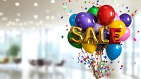 Colorful balloons spelling SALE with confetti explosion on blurred office background. Festive promotional design for retail marketing and special offers.