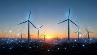Wind turbines at sunset with digital network connections representing renewable energy technology and smart grid infrastructure for sustainable power generation.