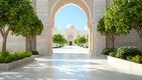 Majestic view of white marble mosque through ornate archway, framed by green trees and landscaped garden path, creating symmetrical architectural perspective.