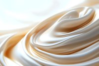 Smooth creamy white and beige swirls create elegant flowing curves and soft waves in luxurious satin-like texture, suitable for cosmetic and spa backgrounds.