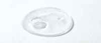 Transparent gel or serum droplet on white surface, isolated cosmetic product for skincare, beauty, and wellness design applications.
