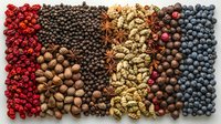 Colorful spices and berries arranged in stripes pattern with peppercorns, star anise, cardamom, blueberries and cranberries on dark background. Food ingredients.