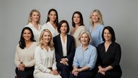 Professional diverse businesswomen team portrait in corporate attire against neutral background for workplace diversity and leadership concepts.
