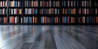 Dark wooden floor leading to wall-mounted bookshelves filled with colorful book spines, creating dramatic perspective in empty library or study room interior.